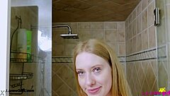 Bright-Eyed Blonde Enjoys Steamy Shower Session