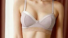 Cute model slips into flowery panties and barefoot lingerie