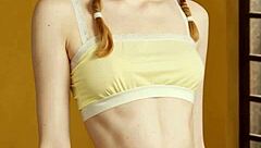 Cute model slips into flowery panties and barefoot lingerie