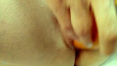 Wife stuffs fat carrot deep in pussy