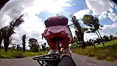 Miniskirted biker flashes panties before outdoor cumshot