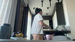 Sexy brunette cleans house flashing shaved pussy