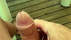 Naked camper strokes huge cock on terrace edge