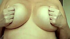 Titia's Solo Tease With Massive Natural Tits