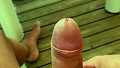 Naked camper strokes huge cock on terrace edge