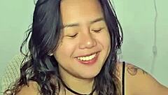 horny asian teen masturbates wildly to throbbing music beats