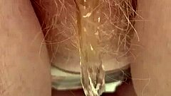 redhead pees through her hairy pussy!