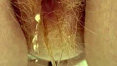 redhead pees through her hairy pussy!