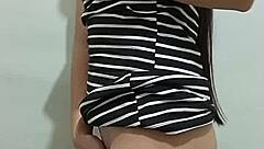 young woman fingers herself seductively in front of watching man