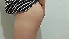 young woman fingers herself seductively in front of watching man