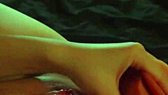 Slow-motion toy play builds to wet orgasm closeup