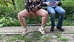 MILF's wet pussy nectar flashes outdoors in miniskirt