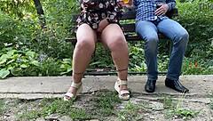 MILF's wet pussy nectar flashes outdoors in miniskirt