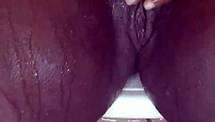 Black milf shaves her wet pussy close-up for homemade fun