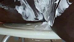 Black milf shaves her wet pussy close-up for homemade fun