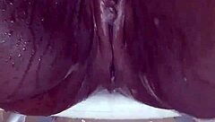 Black milf shaves her wet pussy close-up for homemade fun