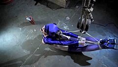 batgirl struggles in tight bondage during this intense hardcore parody scene.