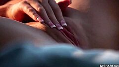 Tasha Reign poses seductively showing off her big natural tits and curves