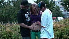 a young pretty blonde teen gets publicly fucked by two guys sucking dicks and taking vaginal pounding while traffic watches the risky orgy