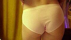 strawberry panties hug her curvy blonde ass as she dances seductively