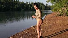 curvy brunette flashes thong bodysuit at lake beach