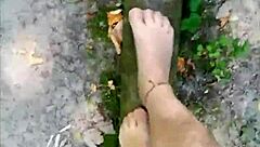 barefoot nylon tease balances outdoors in sheer pantyhose thrill