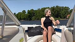 Blonde in lingerie chats with captain on boat