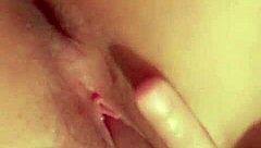 Latina seductively fingers her shaved wet pussy