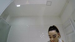 college brunette flashes panties under miniskirt in bathroom