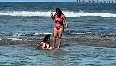 two sexy brazilians enjoying beach kisses outdoors