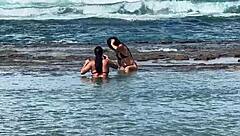 two sexy brazilians enjoying beach kisses outdoors