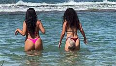 two sexy brazilians enjoying beach kisses outdoors