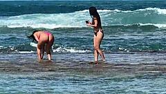 two sexy brazilians enjoying beach kisses outdoors