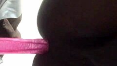 Sleek ebony shemale teases tight ass with toys