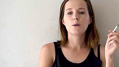 hot brunette smokes and teases voyeur style