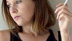 hot brunette smokes and teases voyeur style