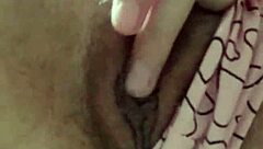 Brunette student fingers hairy pussy under classroom desk to cum