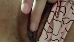 Brunette student fingers hairy pussy under classroom desk to cum