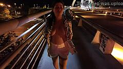 luscious milf struts braless pantyless on bridge flashing huge natural tits