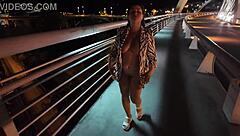 luscious milf struts braless pantyless on bridge flashing huge natural tits