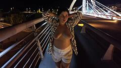 luscious milf struts braless pantyless on bridge flashing huge natural tits