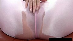 brunette's wet pussy drips through piss-soaked yoga pants close-up