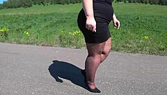 Hey, watch this mature bbw strut in pantyhose heels on public road?