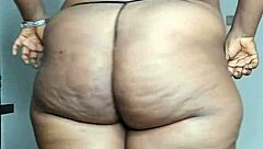 ebony milf's thick cellulite thighs spread wide for solo pussy play?