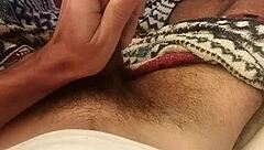 Skinny brazilian guy masturbates huge cock lying down