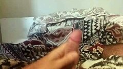 Skinny brazilian guy masturbates huge cock lying down