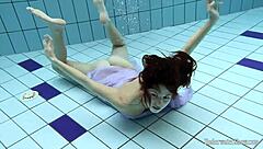 blackhaired aneta dives into seductive pool nudist vibes