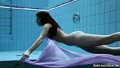 blackhaired aneta dives into seductive pool nudist vibes