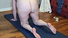 Mature woman flows through naked yoga poses