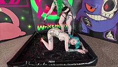 Submissive emo begs tattooed mistress for lesbian strapon fuck